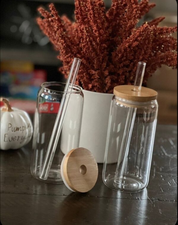 Clear glass tumbler with bamboo lid and straw